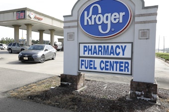 caption: Washington's attorney general has sued to stop Kroger from merging with Albertsons and creating a grocery-store colossus. Here, a Kroger in Flowood, Mississippi operates a gas station and a pharmacy.