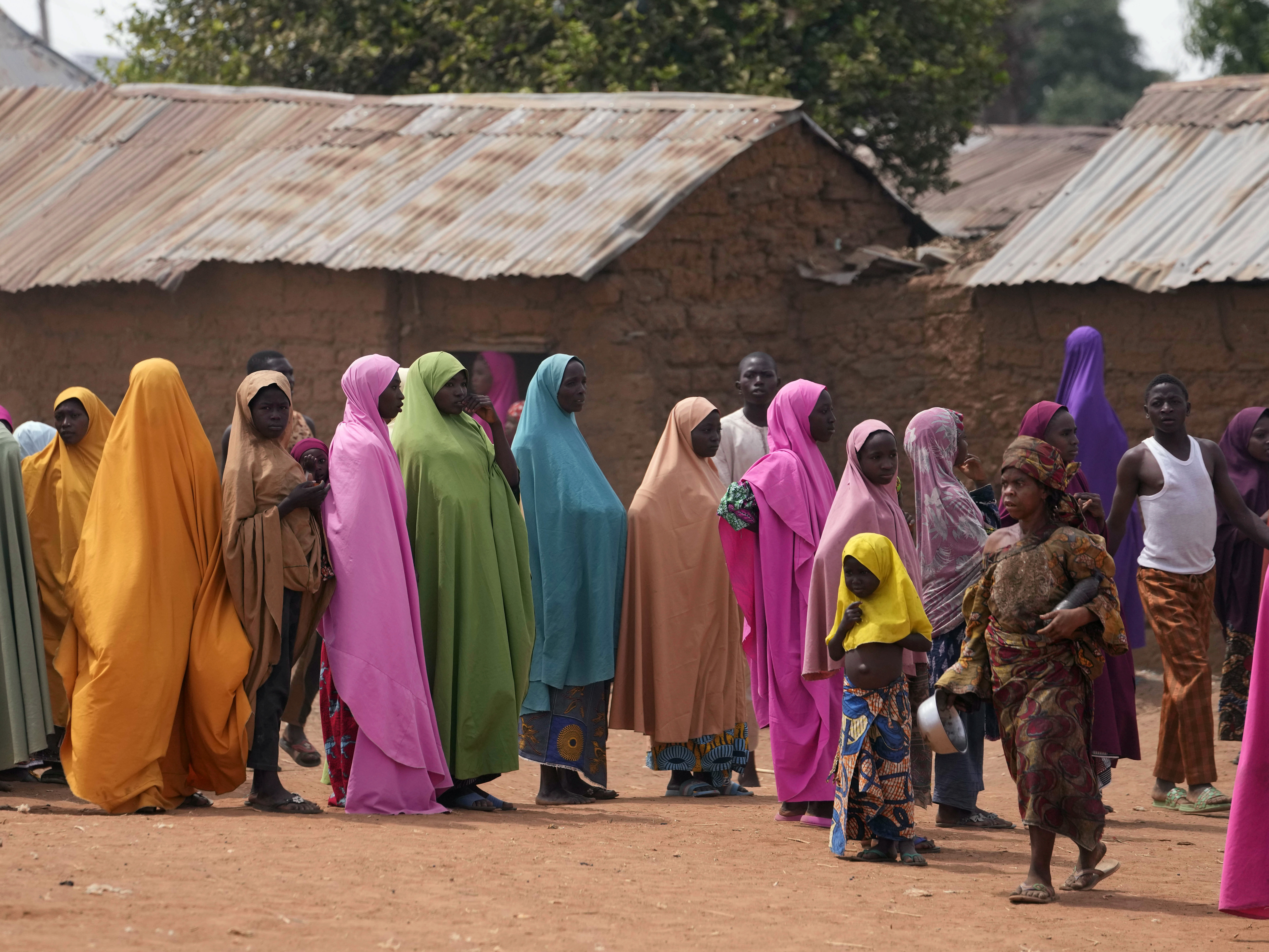 caption: FILE - Parents wait for news about the kidnapped LEA Primary and Secondary School Kuriga students in Kuriga, Kaduna, Nigeria, on March 9, 2024. Nearly 300 schoolchildren abducted from their school in northwest Nigeria's Kaduna state have been released, the state governor said Sunday, March 24, more than two weeks after the children were seized from their school.