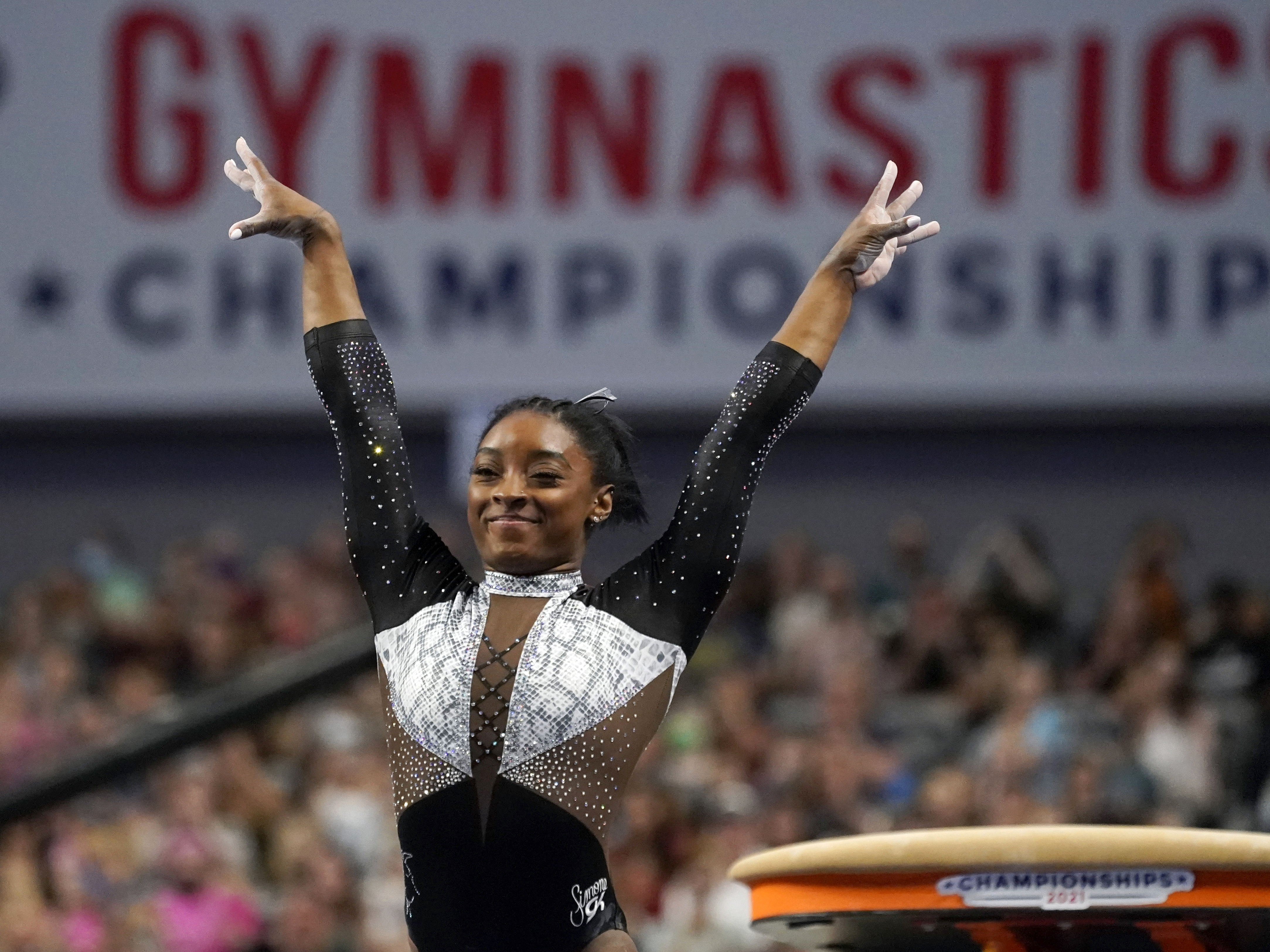 caption: U.S. gymnast Simone Biles, shown here at the U.S. Gymnastics Championships, is seeking a second all-around Olympic gold medal.