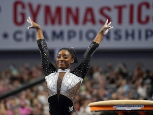 caption: U.S. gymnast Simone Biles, shown here at the U.S. Gymnastics Championships, is seeking a second all-around Olympic gold medal.
