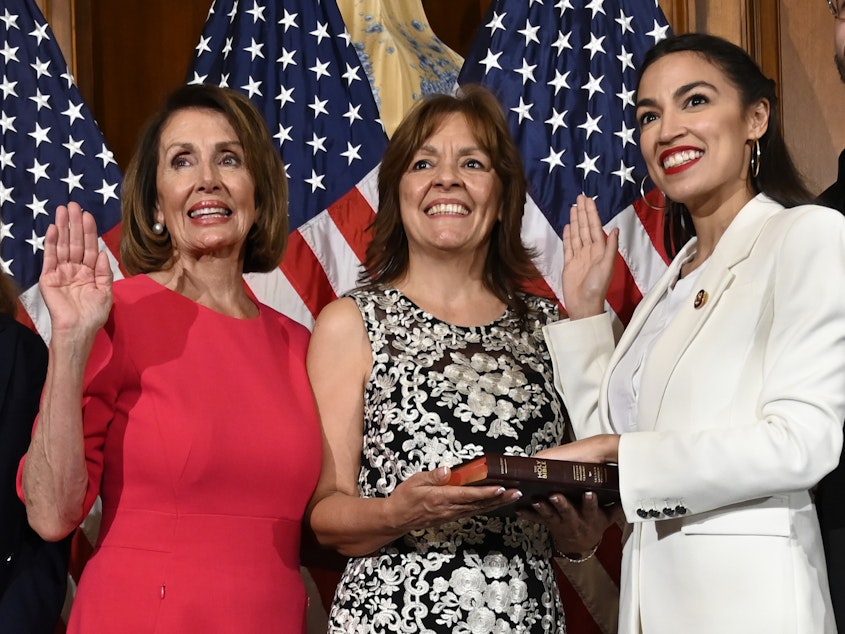 caption: House Speaker Nancy Pelosi of California (left) is trying to move on from a public clash with Rep. Alexandria Ocasio-Cortez, D-N.Y., (right) and other progressives.