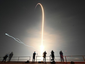 caption: This timed exposer shows the trail as the SpaceX Falcon 9 rocket with the companys Crew Dragon spacecraft lifts off from pad 39A for the Crew-6 mission at NASA's Kennedy Space Center in Cape Canaveral, Florida, early on March 2, 2023.