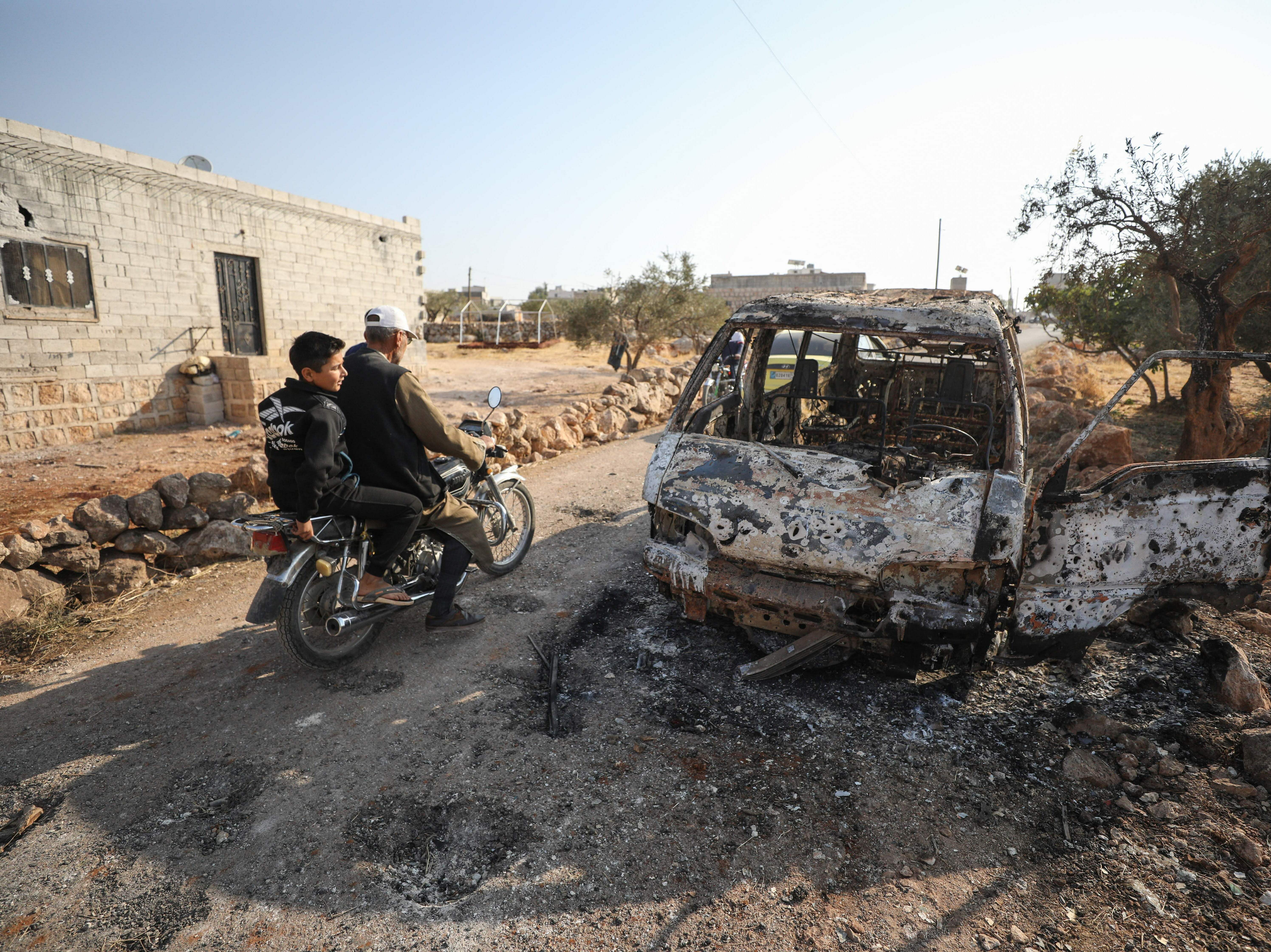 caption: This photo, taken Oct. 27, 2019, the day after the raid on ISIS leader Abu Bakr al-Baghdadi's compound in Syria, shows the van that was targeted by U.S. airstrikes. Photos of the van prompted questions about who was targeted.