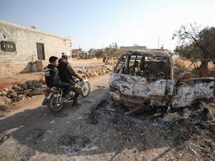 caption: This photo, taken Oct. 27, 2019, the day after the raid on ISIS leader Abu Bakr al-Baghdadi's compound in Syria, shows the van that was targeted by U.S. airstrikes. Photos of the van prompted questions about who was targeted.
