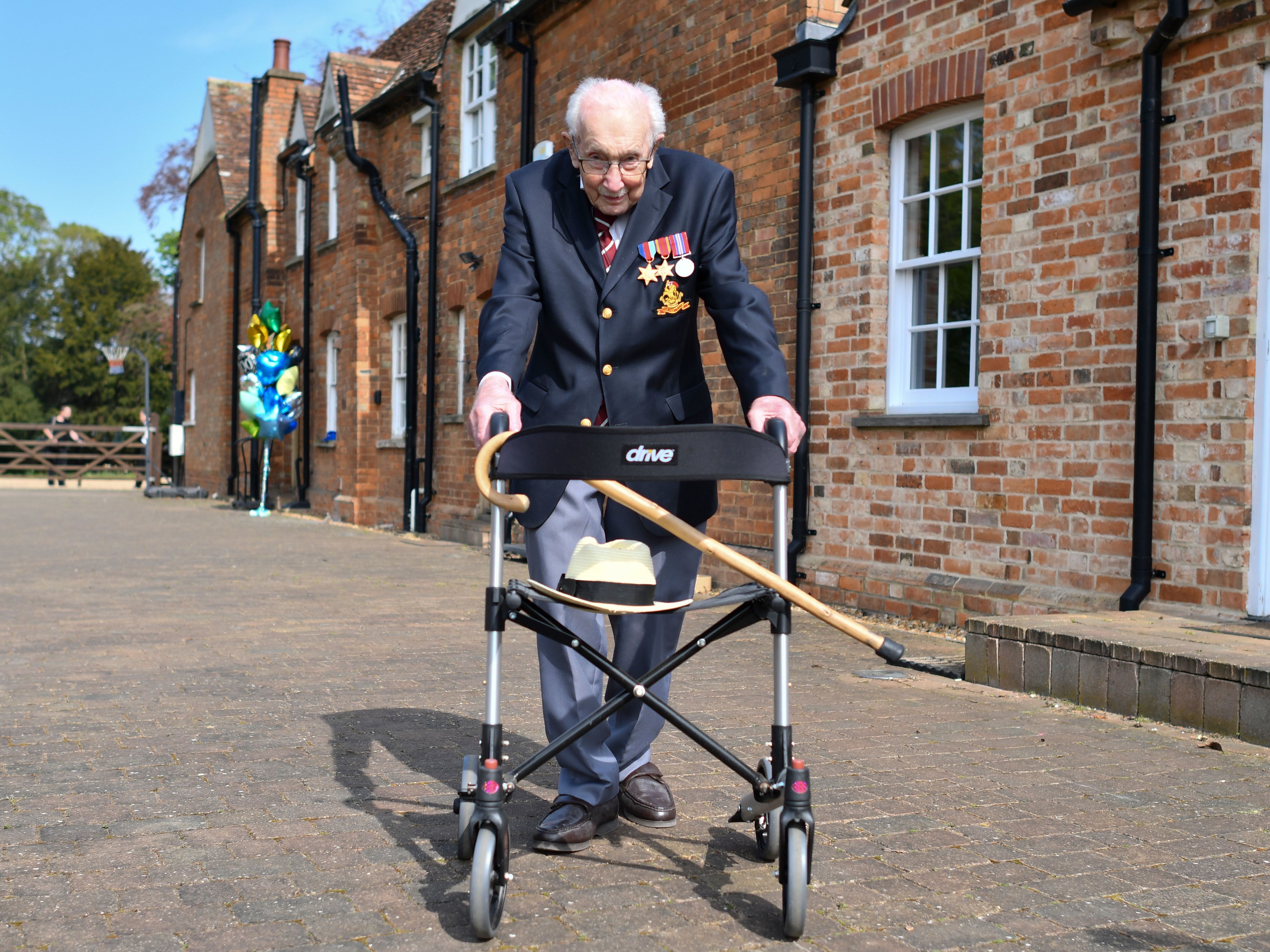 caption: British World War II veteran Capt. Tom Moore raised more than $40 million for health care workers by walking laps in his garden in the weeks leading up to his hundredth birthday in April. He will be knighted in a private ceremony with Queen Elizabeth on Friday.