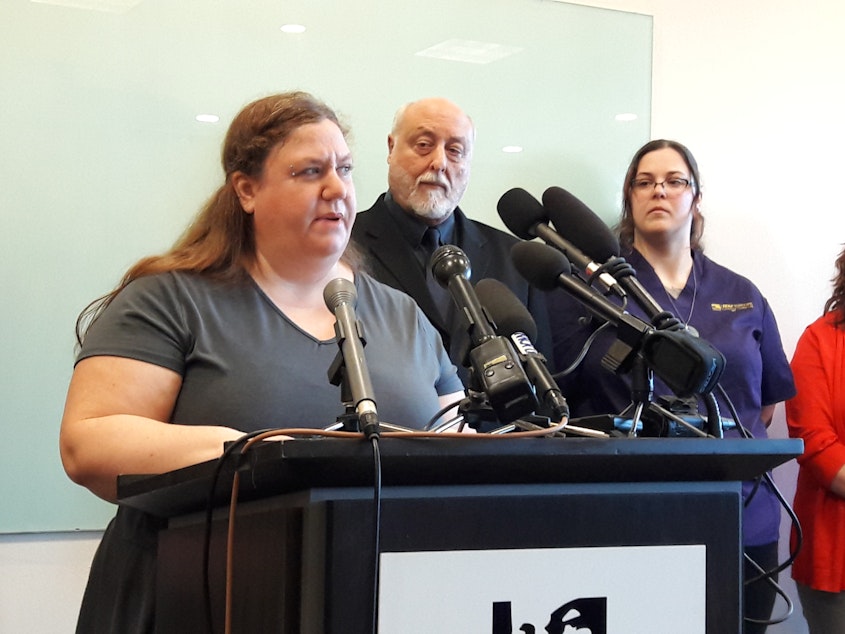 caption: Amy Knickrehm of Seattle told reporters at a news conference Monday that her chronic pain and depression went undiagnosed for years because she had no health care.