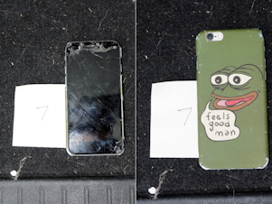 caption: Federal prosecutors say agents found a smashed cell phone in Christian Secor's vehicle while executing a search warrant. The phone case includes the image of Pepe The Frog, a cartoon character that has been appropriated by far-right extremists.