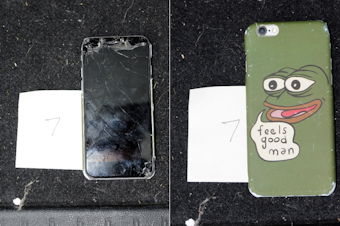 caption: Federal prosecutors say agents found a smashed cell phone in Christian Secor's vehicle while executing a search warrant. The phone case includes the image of Pepe The Frog, a cartoon character that has been appropriated by far-right extremists.