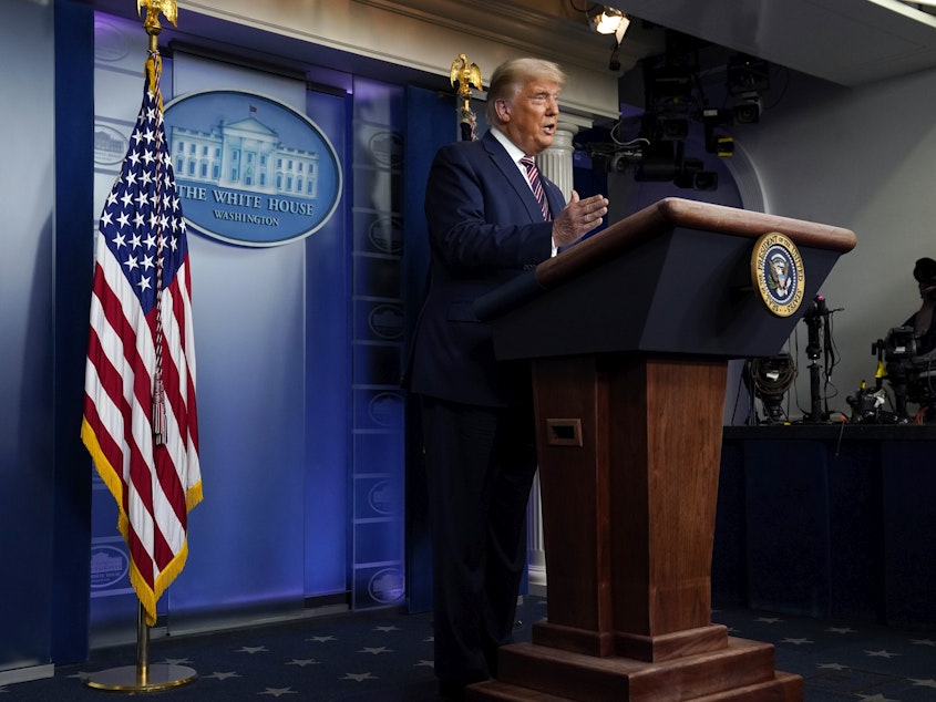 caption: President Donald Trump speaks at the White House on Thursday.