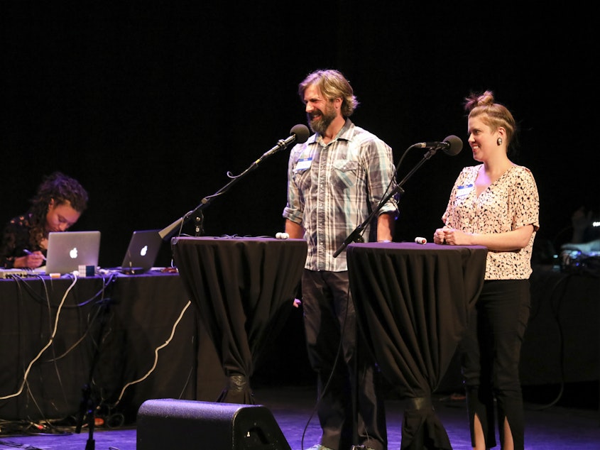 caption: Contestants Dennis Feeney and Lynsi Burton appear on <em>Ask Me Another</em> at the Moore Theatre, in Seattle, Washington.