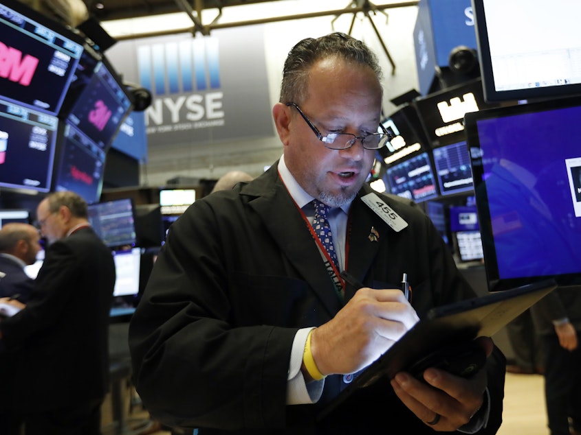 caption: U.S. stock indexes tumbled Wednesday after rebounding a day earlier amid an escalating trade war between the United States and China.