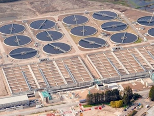 caption: Aerial view of the Beckton Sewage Treatment Works in London. Between February and May, U.K. scientists found several samples containing closely related versions of the polio virus in wastewater at the plant.
