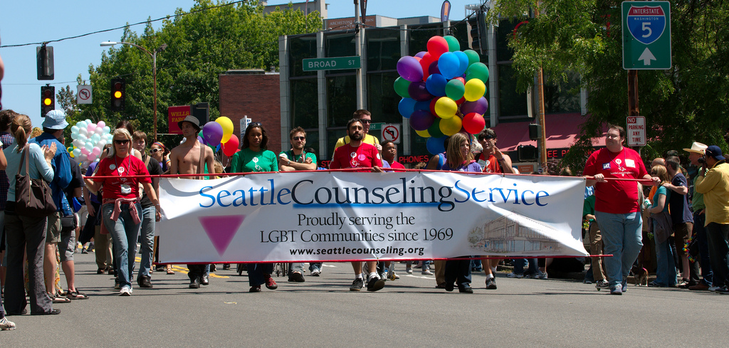 caption: Representatives for Seattle Counseling Services at a Seattle gay pride event.