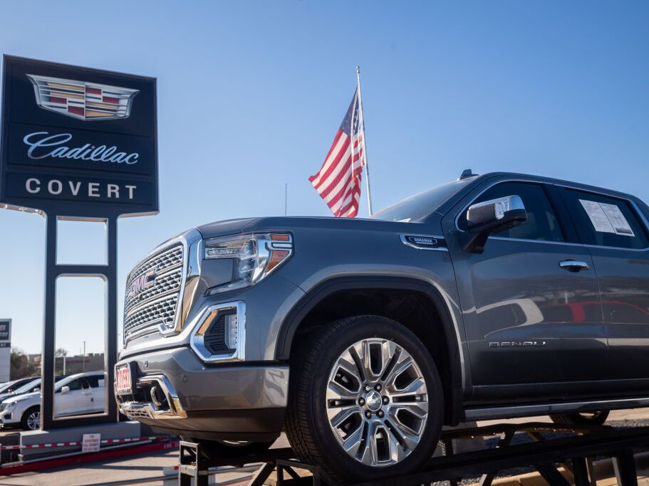 caption: A GMC pickup truck for sale on a lot at a General Motors dealership in January 2023 in Austin, Texas. Federal regulators are proposing new regulations for vehicle design in order to protect pedestrians.  