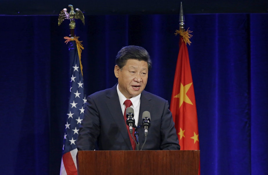 caption: Chinese President Xi Jinping speaks Tuesday, Sept. 22, 2015, at a banquet in Seattle.