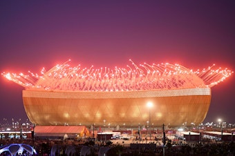 caption: Fireworks are pictured before the start of the Qatar 2022 World Cup final match between Argentina and France at Lusail Stadium north of Doha on December 18, 2022.