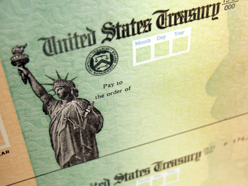 caption: The White House says tax refund checks will go out despite the partial government shutdown.