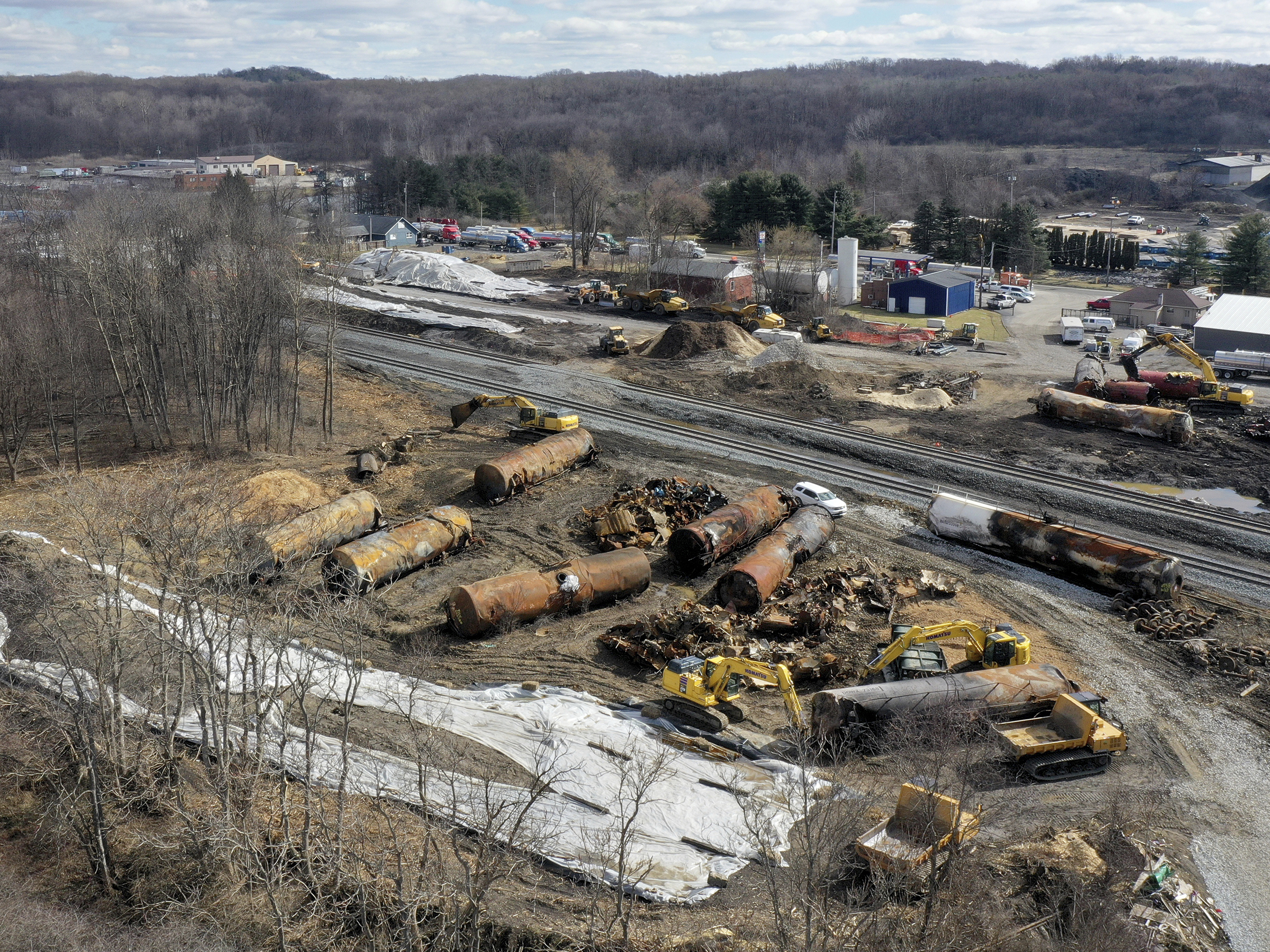 caption: A view of the scene in East Palestine, Ohio, in late February as the cleanup continues at the site of a Norfolk Southern freight train derailment.