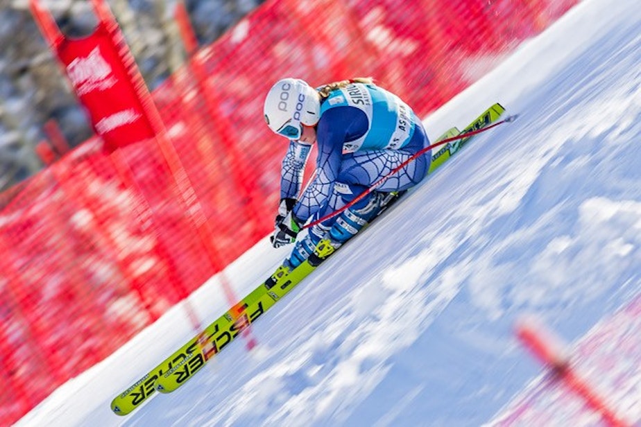 caption: Olympic alpine skier Libby Ludlow, skiing down a course.