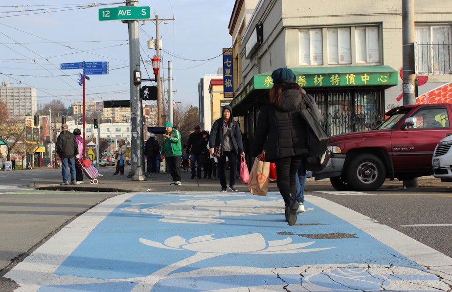 caption: Visitors to Little Saigon in Seattle's Chinatown International District use a decorative crosswalk at the intersection of 12th Avenue South and South Jackson Street.