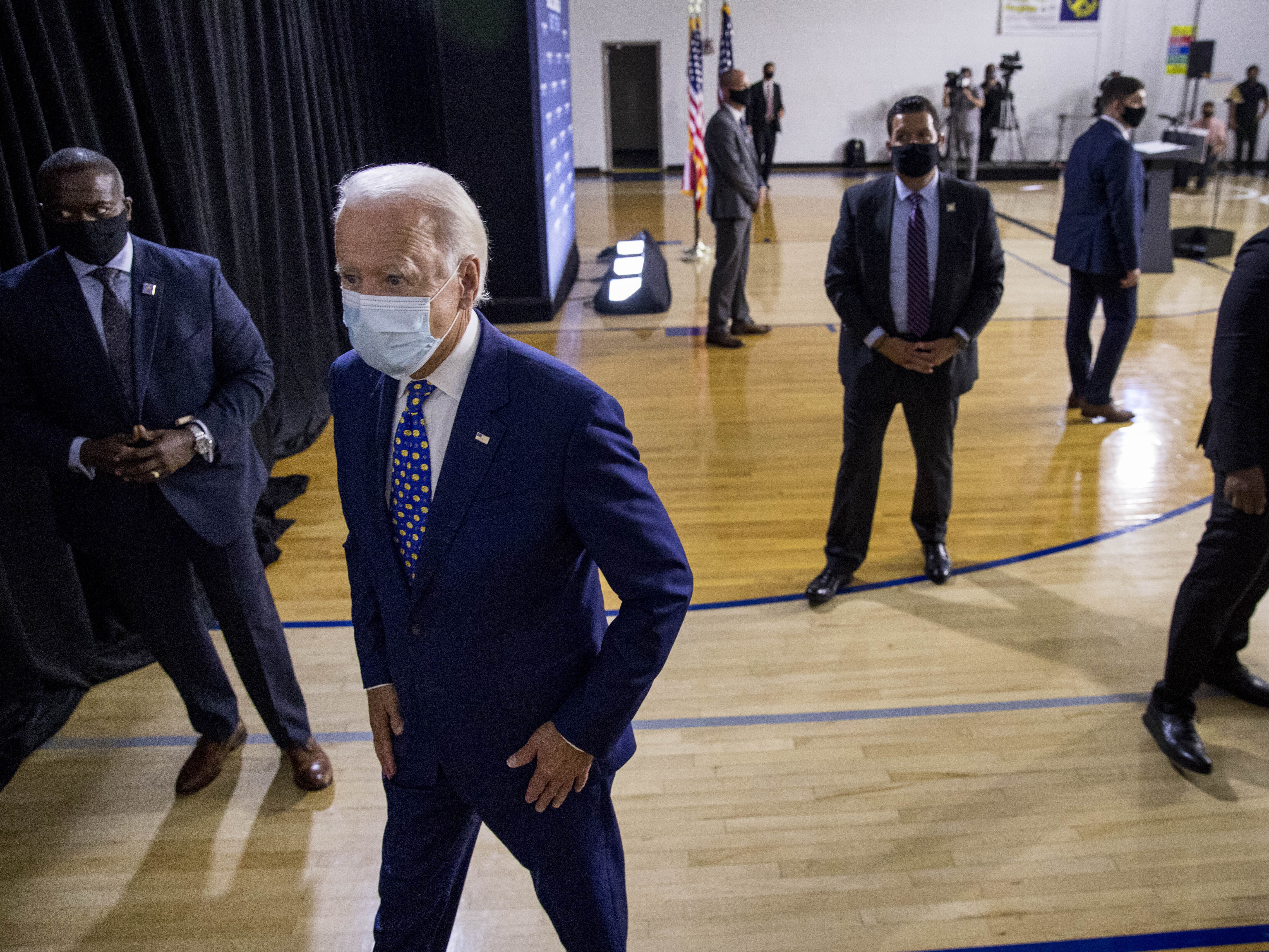 caption: Former Vice President Joe Biden leaves a campaign event last month in Wilmington, Del. If Biden wins the election, he may face political pressure over what to do about President Trump.