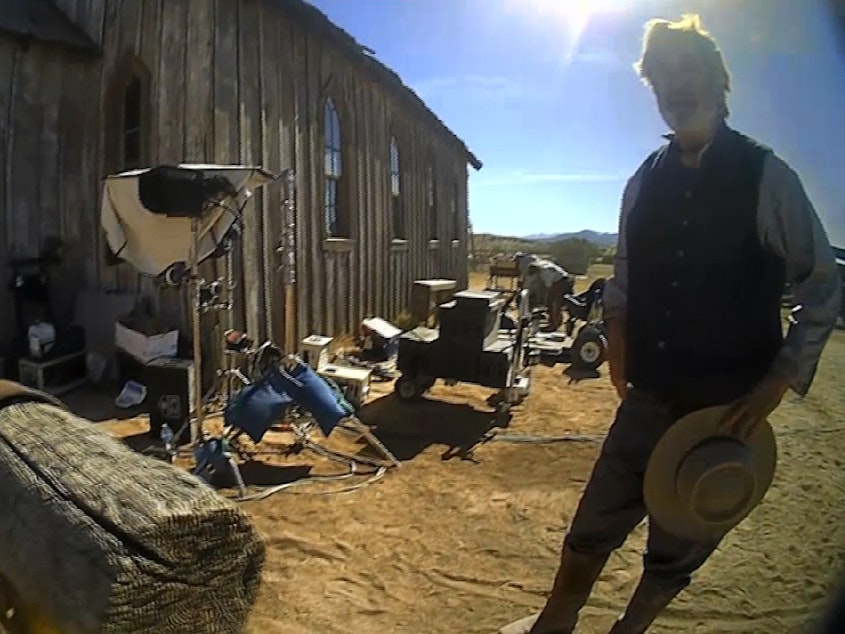 caption: In this image from video released by the Santa Fe County Sheriff's Office, Alec Baldwin speaks with investigators following a fatal shooting on a movie set in Santa Fe, N.M.