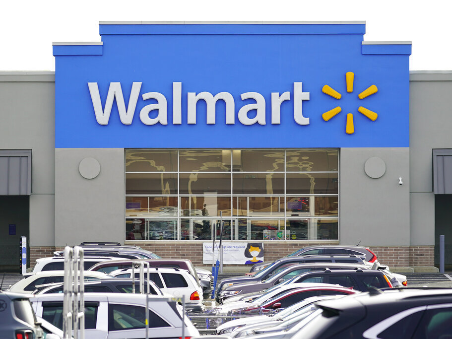 caption: Cars fill up a Walmart parking lot in November in Philadelphia. The Federal Trade Commission said Tuesday that it has sued Walmart for allegedly allowing its money transfer services to be used by scam artists who stole "hundreds of millions of dollars" from customers.