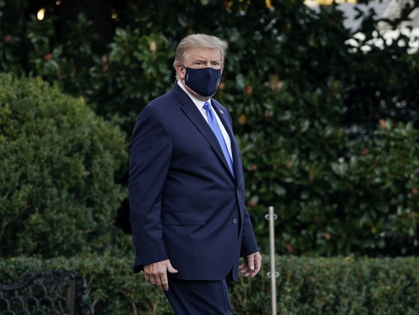 caption: President Trump leaves the White House for Walter Reed National Military Medical Center on the South Lawn of the White House on Friday. Saturday night, he said in a video that he was feeling better as he continues to receive treatment for the coronavirus.