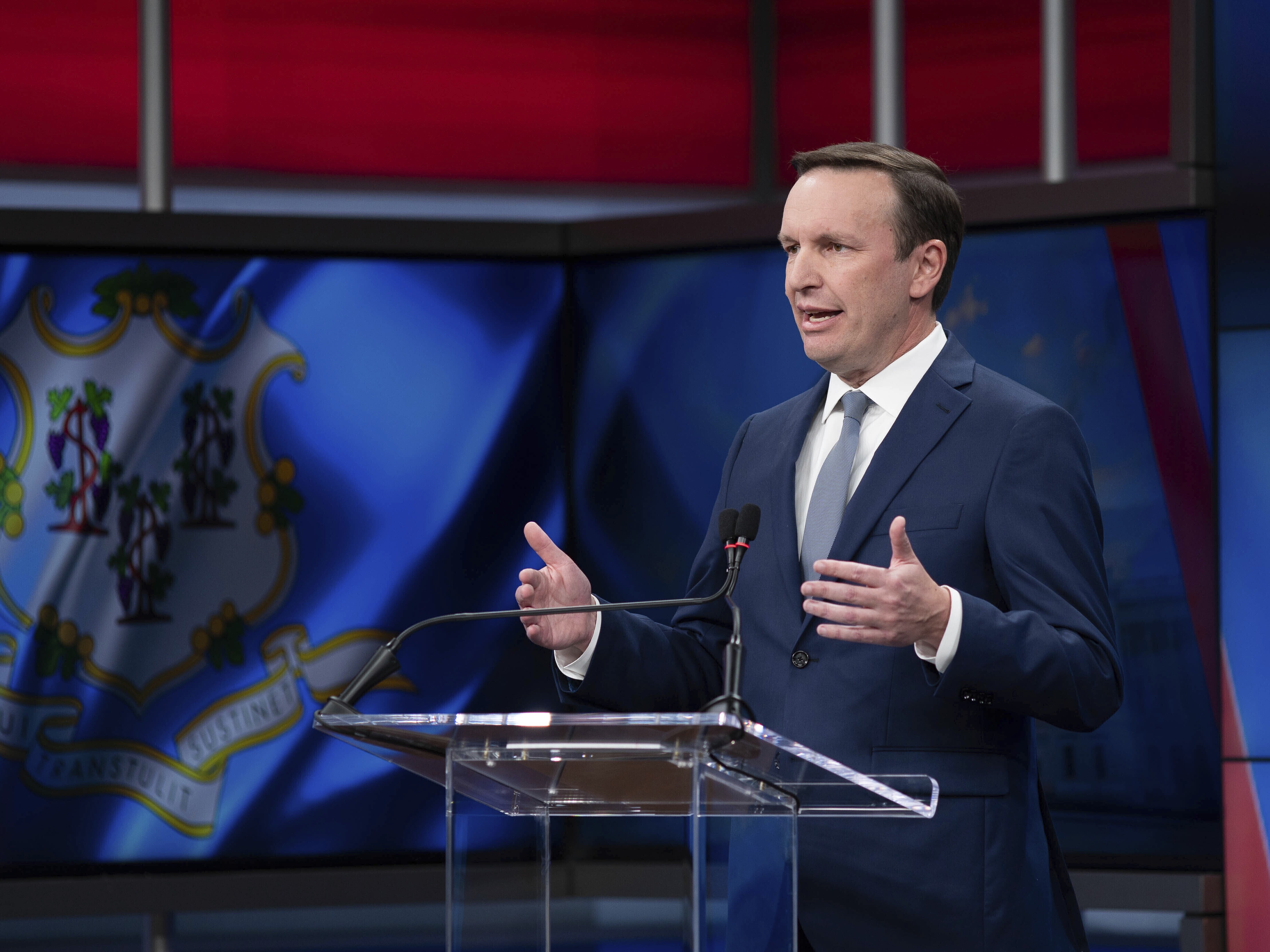 caption: Democratic Sen. Chris Murphy speaks during a debate on Wednesday, Oct. 30, 2024, in New Haven, Conn.