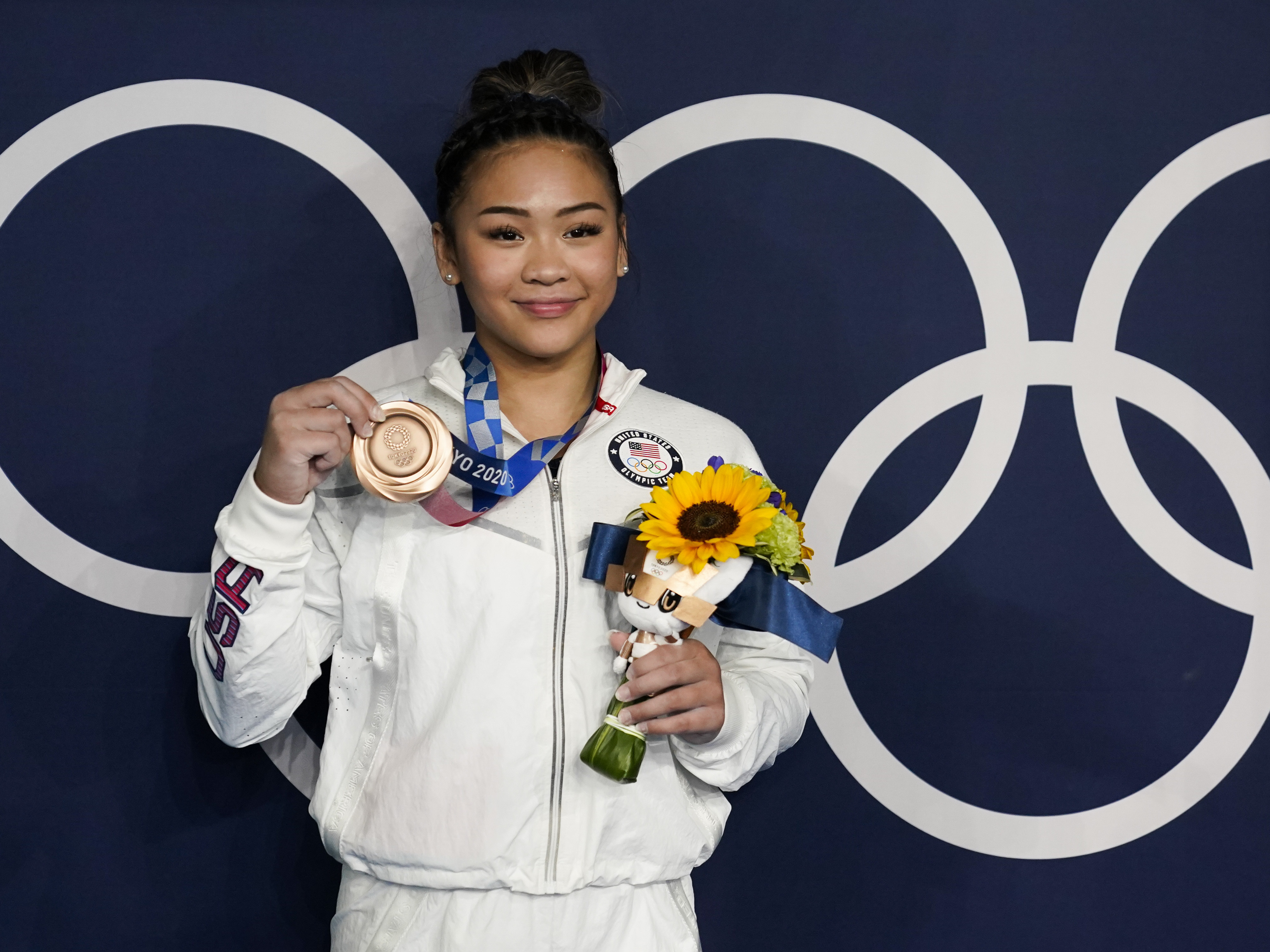 caption: U.S. gymnast Sunisa Lee took home a bronze medal for her performance on the uneven bars at the Tokyo Olympics, as well as a gold medal in the women's all-around.