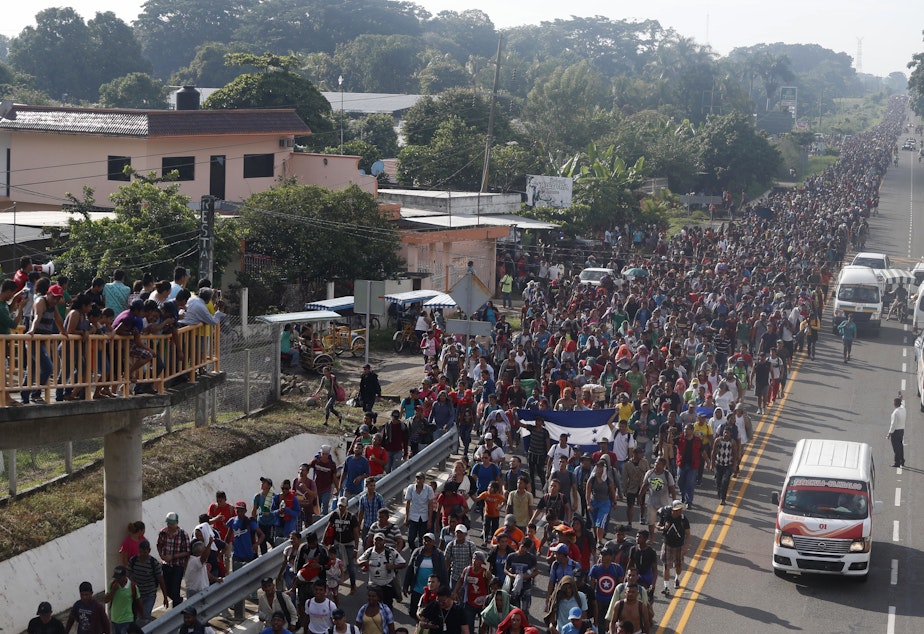 caption: Central American migrants walking to the U.S. start their day departing Ciudad Hidalgo, Mexico, on Sunday. Despite Mexican efforts to stop them at the border, thousands of Central American migrants resumed their advance toward the U.S. border early Sunday in southern Mexico.