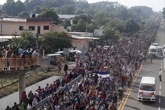 caption: Central American migrants walking to the U.S. start their day departing Ciudad Hidalgo, Mexico, on Sunday. Despite Mexican efforts to stop them at the border, thousands of Central American migrants resumed their advance toward the U.S. border early Sunday in southern Mexico.