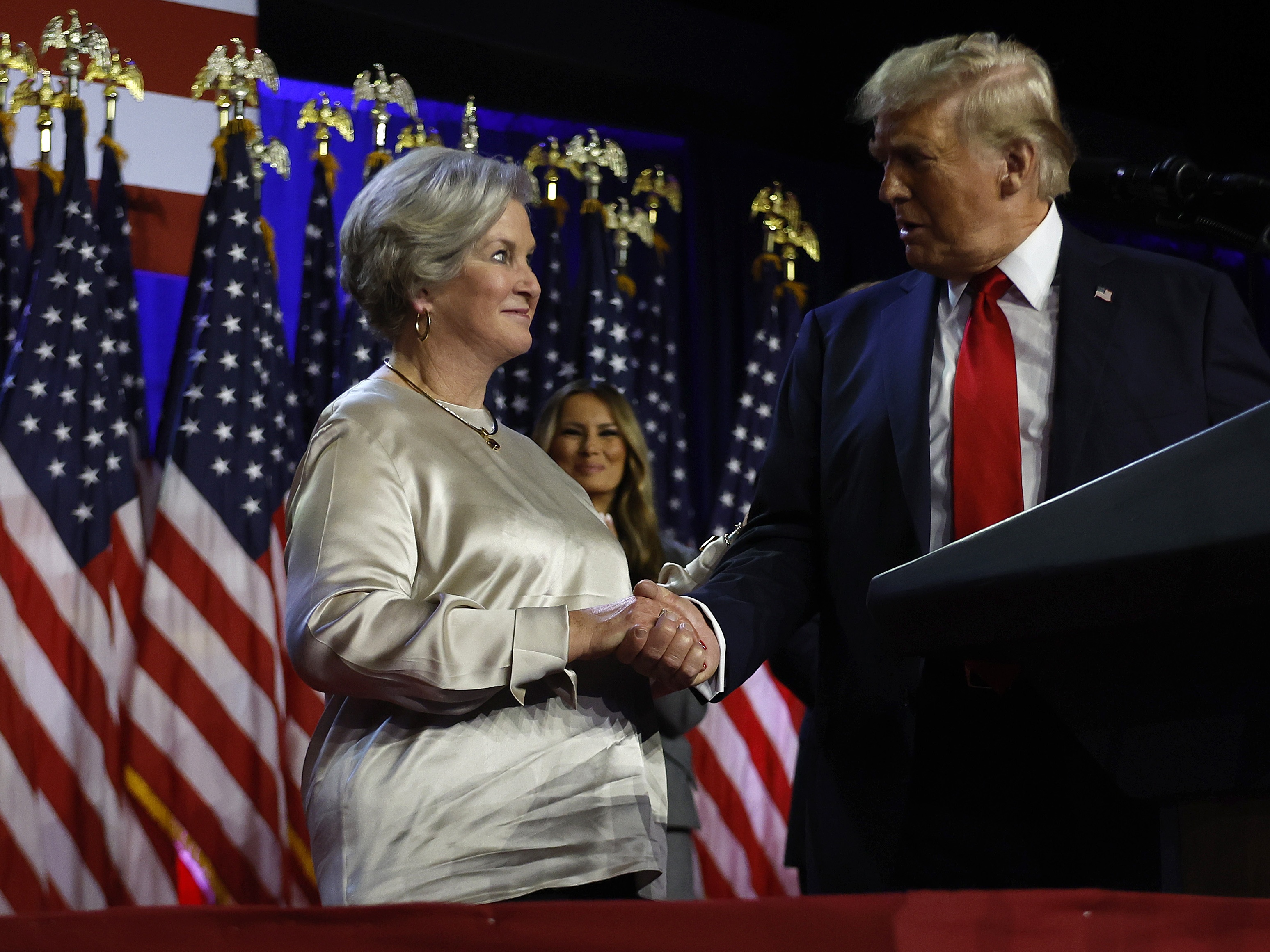 caption: President-elect Donald Trump praises his campaign senior advisor Susie Wiles during an election night event at the Palm Beach Convention Center on Nov. 6 in West Palm Beach, Fla. Trump has asked Wiles to serve as his chief of staff when he takes office in January.