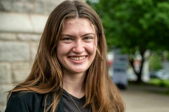 caption: Rikki Held, 22, arrives for the United States' first youth climate-change trial at Montana's 1st Judicial District Court in Helena, Mont., on June 12. She was one of 16 young plaintiffs, ages 5 to 22, who sued the state for promoting fossil fuel energy policies that they say violate their constitutional right to a "clean and healthful environment."