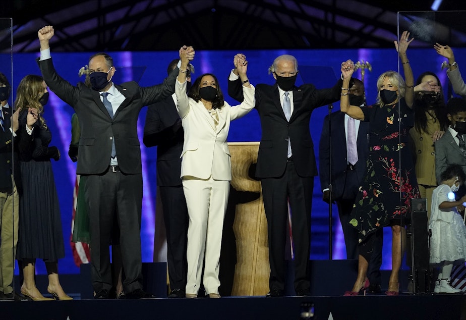 caption: From left, Doug Emhoff, husband of Vice President-elect Kamala Harris, Harris, President-elect Joe Biden and his wife Jill Biden on stage together, Saturday, Nov. 7, 2020, in Wilmington, Del.
