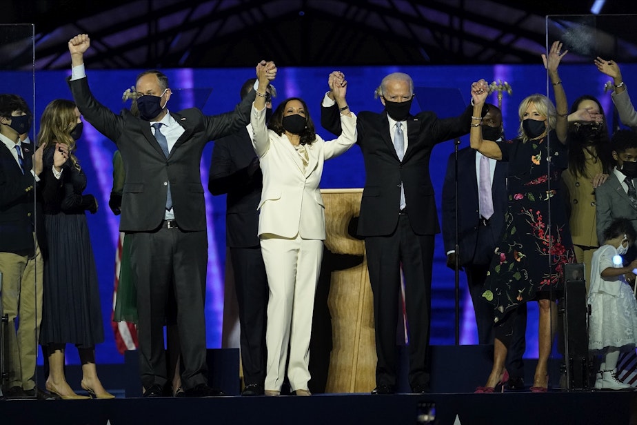 caption: From left, Doug Emhoff, husband of Vice President-elect Kamala Harris, Harris, President-elect Joe Biden and his wife Jill Biden on stage together, Saturday, Nov. 7, 2020, in Wilmington, Del. 