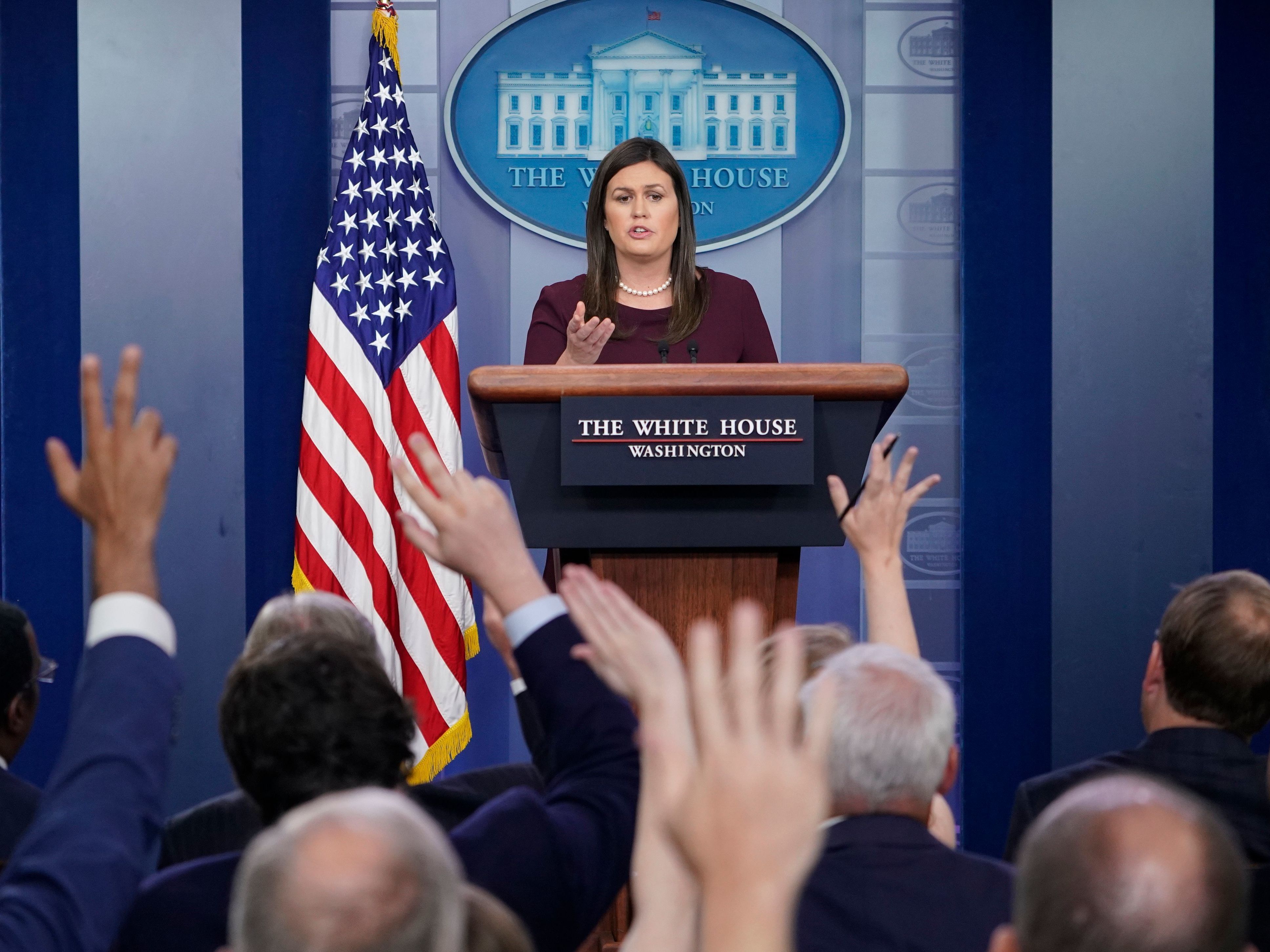 caption: White House press secretary Sarah Sanders' appearances at the once-daily briefings have become fewer and farther between.