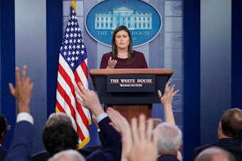 caption: White House press secretary Sarah Sanders' appearances at the once-daily briefings have become fewer and farther between.
