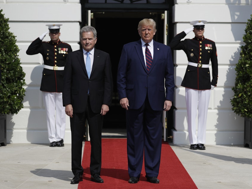 caption: President Trump greets Finnish President Sauli Niinistö on the South Portico of the White House on Wednesday. They are holding a joint press conference amid a building impeachment inquiry into Trump.