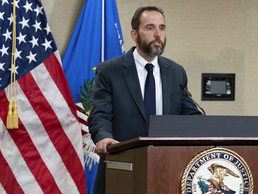 caption: Special counsel Jack Smith speaks to reporters last month in Washington. Smith has asked a court not to delay Trump's trial indefinitely as the former president has requested.