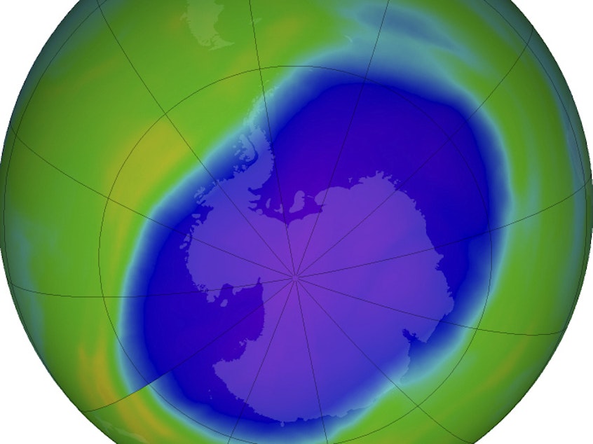 caption: In this false-color image, the blue and purple show the hole in Earth's protective ozone layer over Antarctica on Oct. 5. Earth's ozone layer is slowly but noticeably healing.
