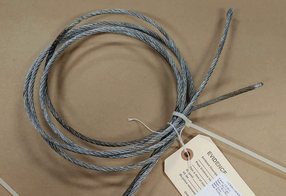 caption: This cable, burned in half by an arc of high-voltage electricity, was recovered from a damaged substation in Toledo, Washington, on Aug. 5, 2022.