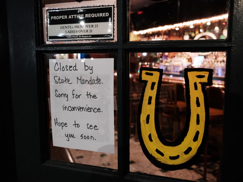 caption: A Brooklyn restaurant tells would-be customers it is closed on Sunday, after a decree that all bars and restaurants in New York City shut down.