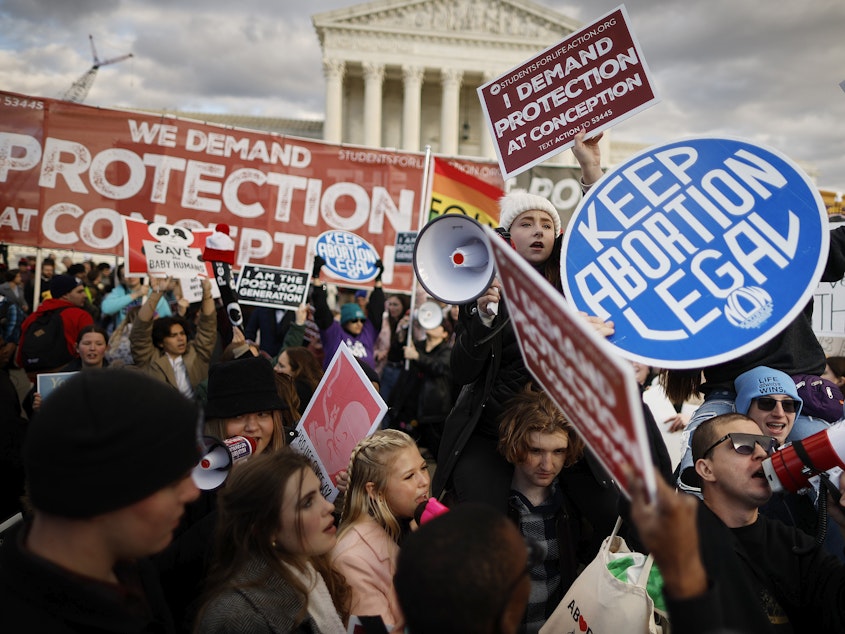 caption: Anti-abortion and abortion rights activists protest in Washington, D.C. at the March for Life rally in January. The decision triggered strict abortion bans in more than a dozen states. A new study shows widespread confusion about abortion bans at Oklahoma hospitals.
