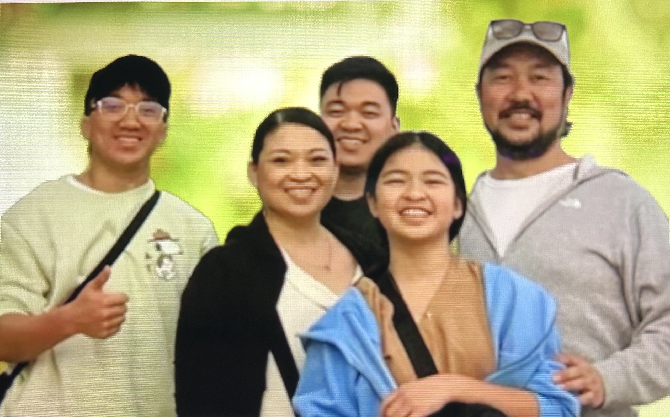 caption: Chittakone “Alan” Phetsadakone, his wife Cheryl Eugenio, and three of their children pose for a photo. 