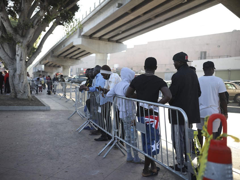 caption: Migrants from Haiti, Africa, and Central America wait to see if their number will be called to cross the border and apply for asylum in the United States, at the El Chaparral border crossing in Tijuana, Mexico, in September 2019.