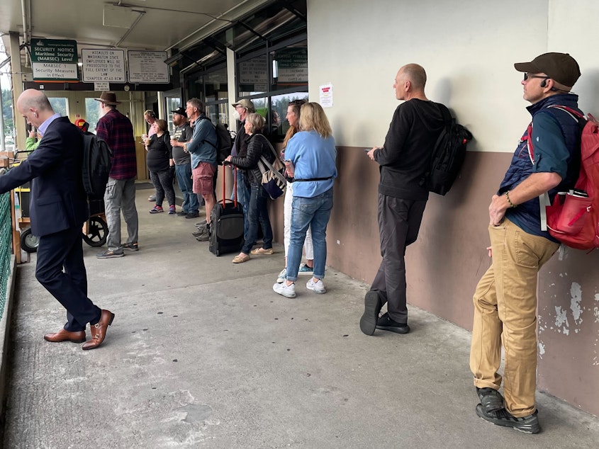 caption: People were waiting in line for the 7:55 a.m. Bainbridge-to-Seattle ferry on Sept. 7, 2023. A handful of people arrived at the terminal unaware of the changes to the schedule and the prohibition on cars and bicycles on the ferry. 