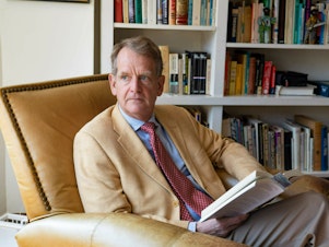 caption: John B. Chambers is the former deputy head of the Sovereign Debt Ratings Group and former chairman of the Sovereign Debt Committee at Standard and Poor's. The ratings agency in 2011 made a major decision to strip away the country's AAA rating.