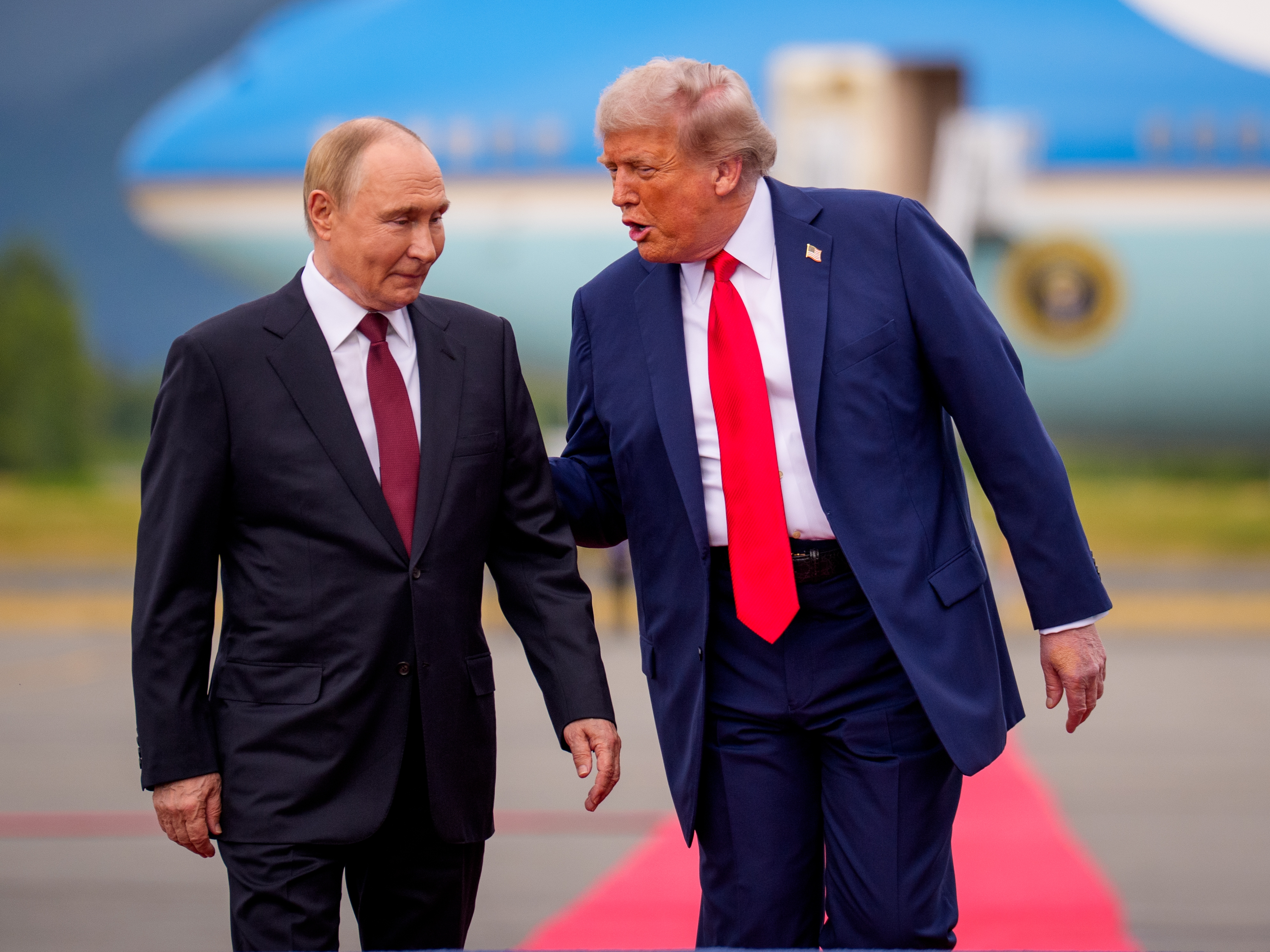 caption: President Trump greets Russian President Vladimir Putin at Joint Base Elmendorf-Richardson on Friday in Anchorage, Alaska. On his flight to Alaska, Trump said his top priority was a ceasefire in the Russia-Ukraine war. After meeting with Putin, Trump said a ceasefire was not essential, and it was better to seek a permanent peace agreement.