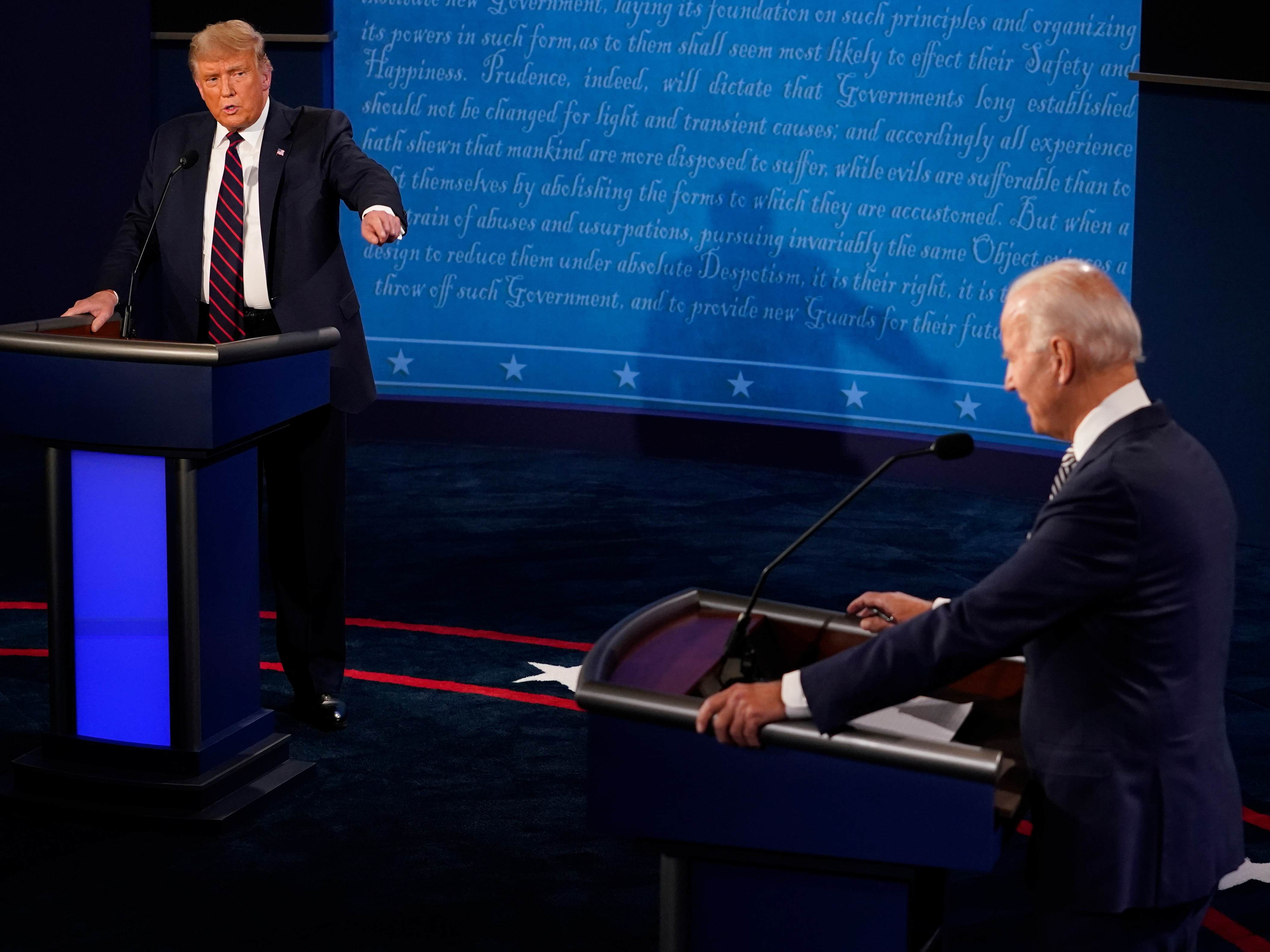 caption: In this file image, then-President Donald Trump and then-former Vice President and Democratic presidential nominee Joe Biden speak during the first presidential debate on September 29, 2020 in Cleveland, Ohio.